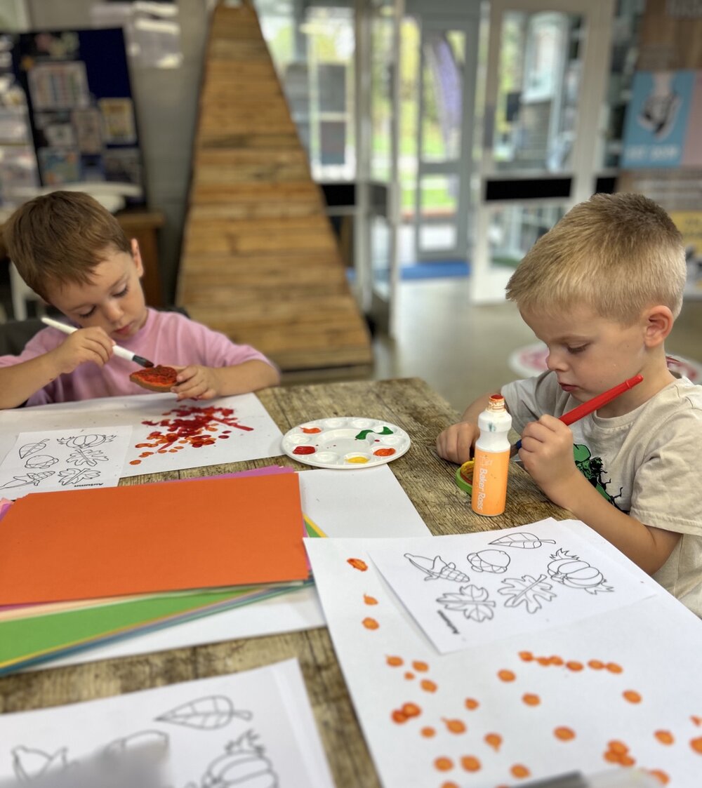 Children painting with brushes